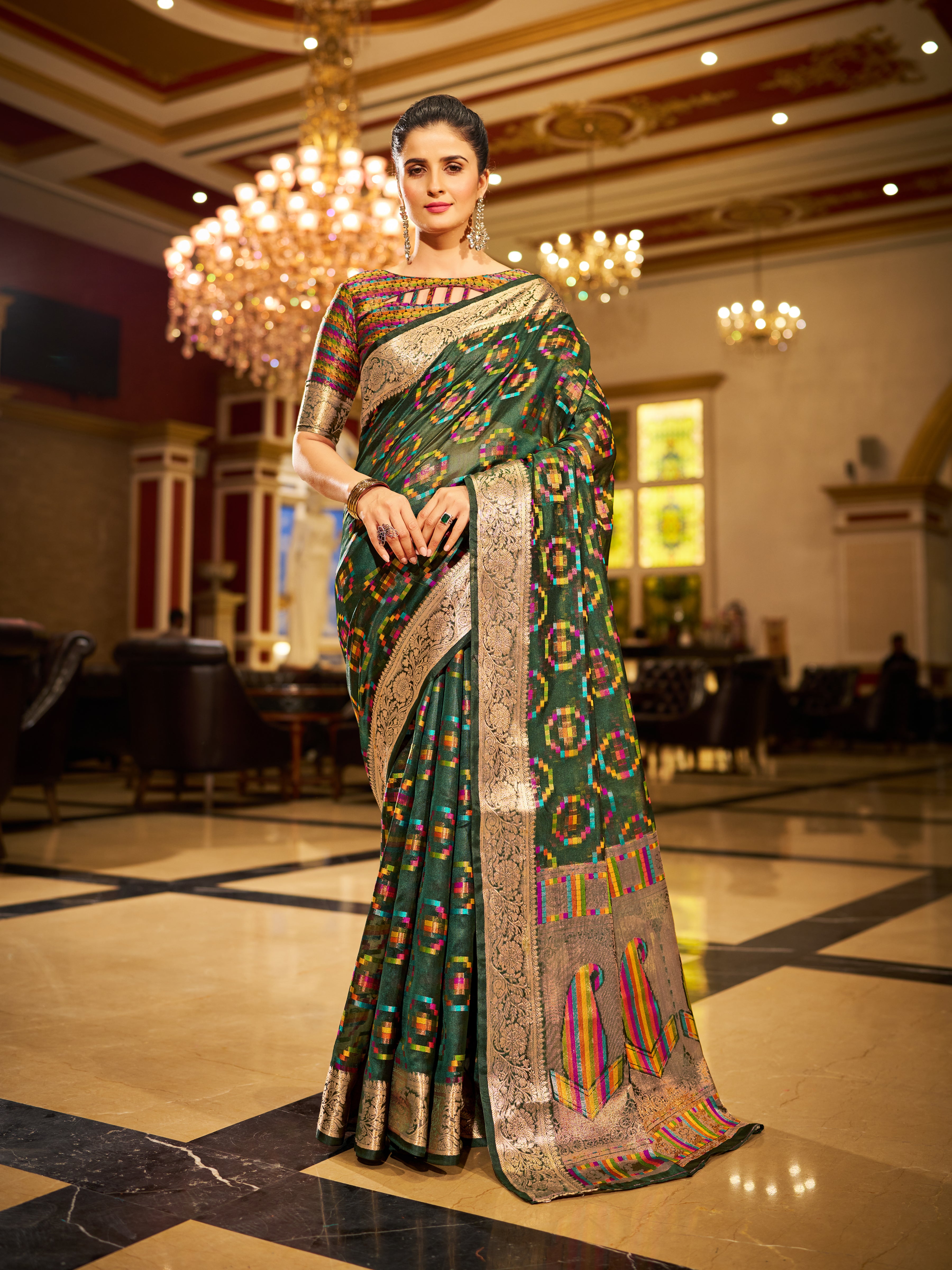 Deep green and accented with luxe Gold Organza Saree With Unstitched Blouse